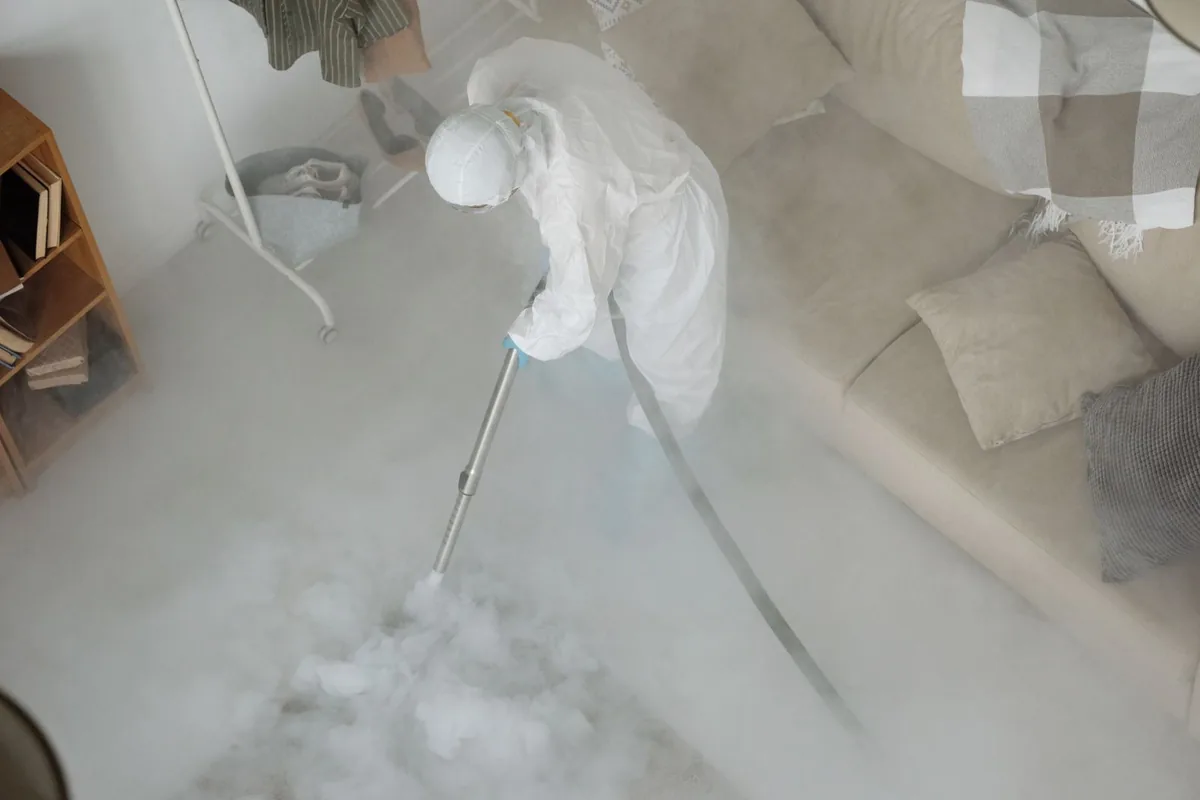 Biohazard cleanup technician in protective equipment, Loch Lomond, VA